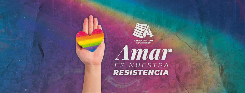 Sobre un fondo de colores de la bandera LGBT una mano que sostiene un corazón con colores de la misma bandera. Logo de Casa Frida Refugio. Texto: Amar es nuestra resistencia.